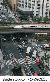 
Tokyo, Japan - October 31, 2019 : Shinkansen (Japanese Bullet Train) On A Track, Top View From  Tokyu Plaza Ginza Rooftop In Tokyo. Some Motion Blur.