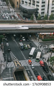 
Tokyo, Japan - October 31, 2019 : Shinkansen (Japanese Bullet Train) On A Track, Top View From  Tokyu Plaza Ginza Rooftop In Tokyo. Some Motion Blur.