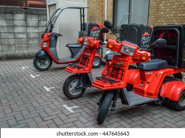 TOKYO. JAPAN: Pizza Hut Delivery Motorcycle Bike, On July 5, 2016.  Japanese Pizza Hut  Is One Of The Biggest American Restaurant Chains And International Franchises In Japan 