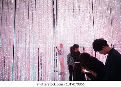 Tokyo / Japan - Sept 12 2018: Mori Digital Art Museum, Odaiba. Pink Electric Lights. Exhibition By Team Lab In The Mori Digital Art Museum. Guy In Pink Shorts