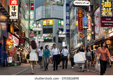 Tokyo, Japan – September 1, 2016: Horizontal Low Angle View Of The Crowd Strolling Through The Restaurants Plenty Of Colorful Neon Signs On Shibuya Center-gai, Shibuya District