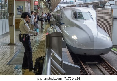 TOKYO, JAPAN - SEPTEMBER 16TH, 2017. Female High Speed Train Conductor In Tokyo Railway Station.