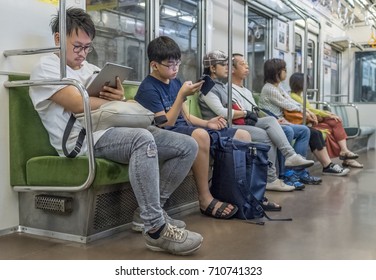 TOKYO, JAPAN - SEPTEMBER 2ND, 2017. Commuters in the Tokyo Metro subway train. - Shutterstock ID 710741323