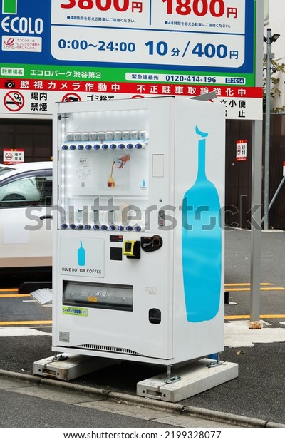 TOKYO, JAPAN - September 8, 2022: A drinks vending\
machine stocked with Blue Bottle Coffee products in a parking lot\
Tokyo\'s Shibuya area.