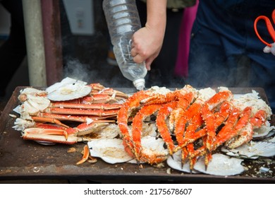 Tokyo, Japan Street In Tsukiji Outer Market In Ginza With Closeup Retail Sample Display Of Cooked Red Crab Lobster Legs White Meat
