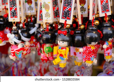 TOKYO, JAPAN-9 March,2019: Beautiful Culture Wooden Doll Keychains Souvenir, Japanese Traditional Wood Carvings Sold In Asakusa Market, Tokyo, Japan 