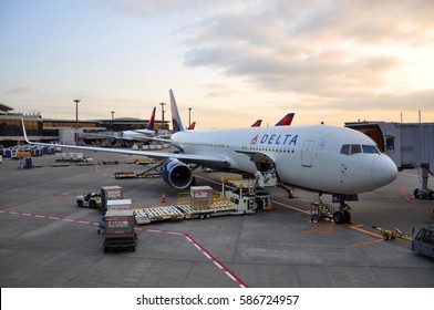 TOKYO - JUN. 14, 2012: Delta Boeing 767-332(ER) in airport at sunset at Tokyo Haneda Airport (HND), Tokyo, Japan.