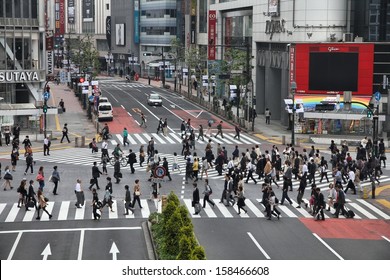 TOKYO - MAY 11: Commuters hurry on May 11, 2012 in Shibuya, Tokyo. Shibuya crossing is one of busiest places in Tokyo and is recognized thanks to being featured in multiple films.