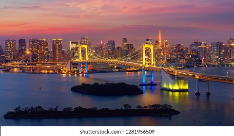 Tokyo Rainbow bridge in night time with Tokyo city background and tower and sunset sky, this immage can use for travel and cityscape in Japan and Asia