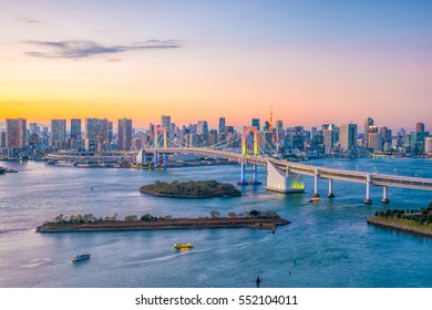 Tokyo skyline with Tokyo tower and rainbow bridge at sunset in Japan - Powered by Shutterstock