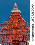 Tokyo tower faces blue sky with no clouds