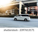 Tokyo,Japan - Januari 01,2023 ; A white Toyota Alphard passes on the highway.