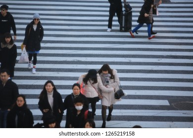 Tokyo/Japan- January 14 2018: japanese cross the road on Shibuya street. Shibuya is one of the famous business area in Tokyo.