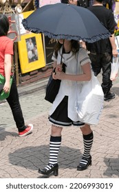 TOKYO,JAPAN-JULY 05: Unidentified Girl With Black Umbrella Shopping At  Harajuku Street. July 05,2008 In Tokyo, Japan