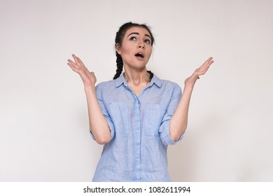 I Told You That Everything Will Be The Same As I Said. Portrait Of A Beautiful Brunette Girl On A Gray Background Showing Different Emotions.