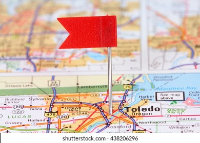 Toledo, Ohio. Red flag pin on an old map showing travel destination.