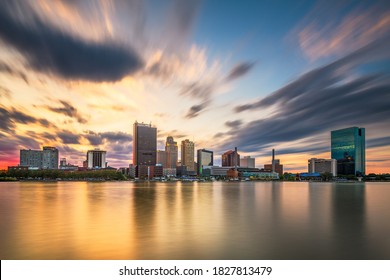 Toledo, Ohio, USA downtown skyline on the Maumee River at dusk.