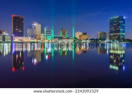 Toledo, Ohio, USA downtown skyline on the Maumee River at twilight.