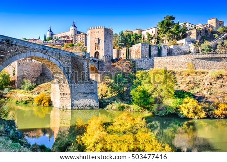 Toledo, Spain. Alcazar and Alcantara Bridge ( Puente de Alcantara), an arch bridge in Toledo, spanning the Tagus River.