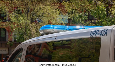 Toledo, Spain - April 28, 2018: On The Central Square Of The City On A Spring Day, A Spanish Police Car Monitors Tourists