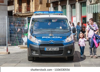 Toledo, Spain - April 28, 2018: On The Central Square Of The City On A Spring Day, A Spanish Police Car Monitors Tourists