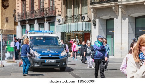 Toledo, Spain - April 28, 2018: On The Central Square Of The City On A Spring Day, A Spanish Police Car Monitors Tourists