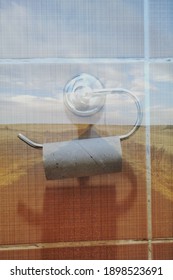 Toliet Paper Roll Placed On A Toliet Paper Holder Inside Of A Restroom Stall