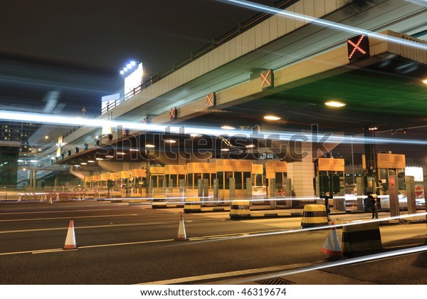 toll booths with car\
light in Hong Kong