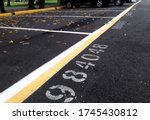 The toll code for the parking lot location is on the asphalt road