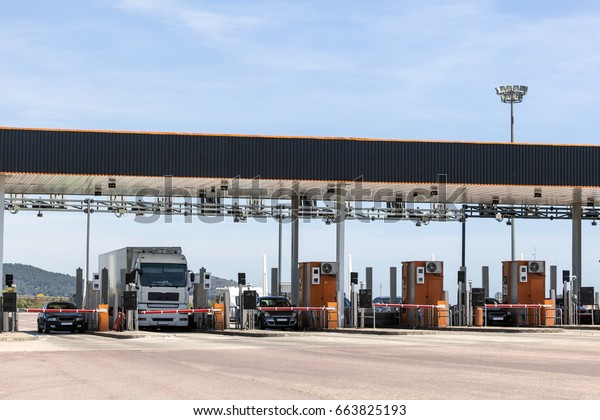 Toll gate on the\
highway in southern Spain