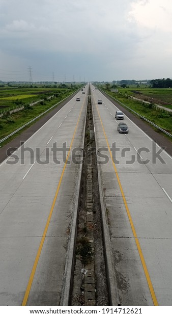 Toll road with a rice\
field atmosphere