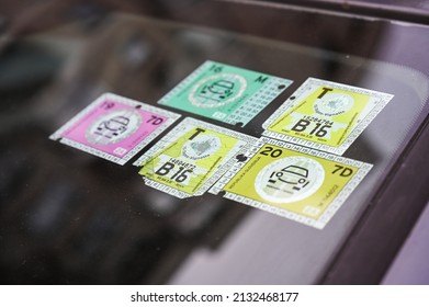 Toll stickers for motorways on car windshield. Vignette road toll. Motorway toll sticker. Inscription: dates, Republic of Slovenia, Toll, month. - Shutterstock ID 2132468177