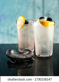 Tom Collins Cocktail In A Highball Glass, With Fruit In A Lifestyle Setting 