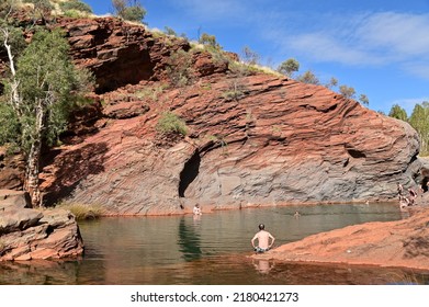 TOM PRICE, WA - JUNE 15 2022:Group Of Australian People Enjoying The Water And View Of Hamersley Gorge In Karijini National Park In The Pilbara Region Western Australia