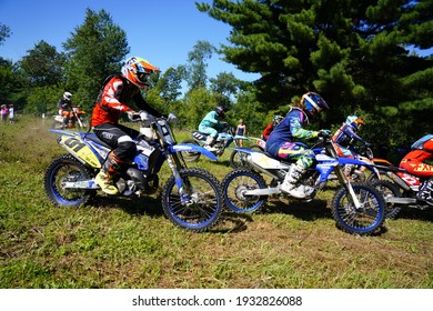 Tomah, Wisconsin USA - October 11th, 2020: Adult Dirt Bike Riders Travel Through Forest Track In A GP Motocross Race Event.  