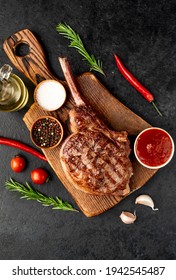 Tomahawk Beef Steak Grilled With Spices On Stone Background