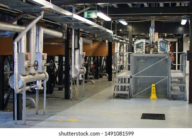 Tomatin, Inverness, Scotland - April 30 2019: The Still House Of The Tomatin Distillery In The Scottish Highlands. This Is The Lower Part Of The Copper Stills