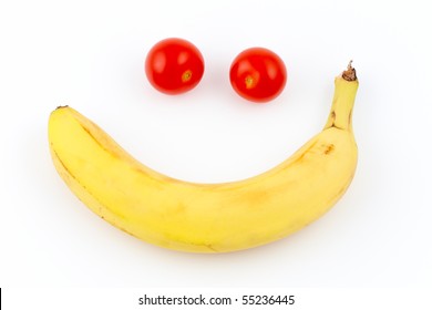 tomato and banana forming a smiley face isolated on white - Powered by Shutterstock