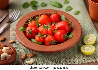 Tomato Basil Salad Vegetarian Salad Of Fresh Ripe Organic Tomatoes From Home Farm Garden Cherry Tomatoes In A Clay Bowl Raw Vegetable Salad Vegetarian Vegan Diet Kerala India. Good Source Vitamin C