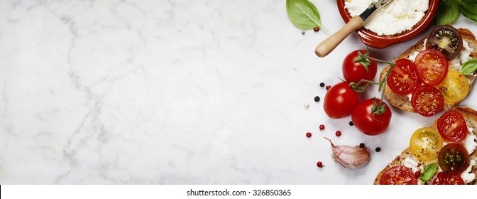 Tomato and basil sandwiches with ingredients - Italian, Vegetarian or Healthy food concept - Shutterstock ID 326850365