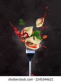 Tomato Chilli Coriander Shell Pasta Splashing Sauce Tomato Fork Dark Green Red Bite Cooking Hot Steam Steamy Explosion Splash Seeds Silver Mess Commercial Levitation Art Spoon Crunchy Fresh Flavour