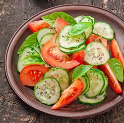 Tomato And Cucumber Salad With Black Pepper And Basil
