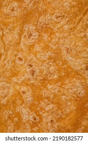 Tomato Flavored Wheat Tortilla Wraps. Spanish Or Mexican Circular Unleavened Flatbread From Wheat Flour. Ingredient For Cooking Fast Food Or Snack. Closeup, Texture Background