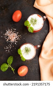 Tomato Juice With Basil, Himalayan Salt And Sour Cream In Glass On A Black Concrete Background With Orange Textile. Healthy Drink Concept. Top View, Flat Lay, Close Up.