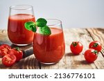 Tomato juice. Fresh red tomato detox juice in glass. Homemade tomato juice.