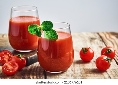 Tomato juice. Fresh red tomato detox juice in glass. Homemade tomato juice.