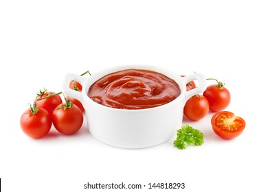 Tomato Ketchup In A White Bowl With Tomatoes On White