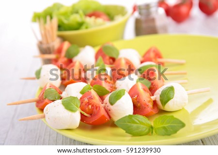 Similar – Image, Stock Photo Tomato mozzarella skewers with basil