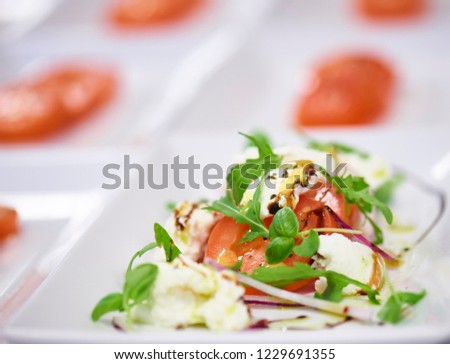 tomato and mozzarella salad with rocket salad