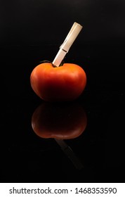 Tomato On A Black Shinny Floor